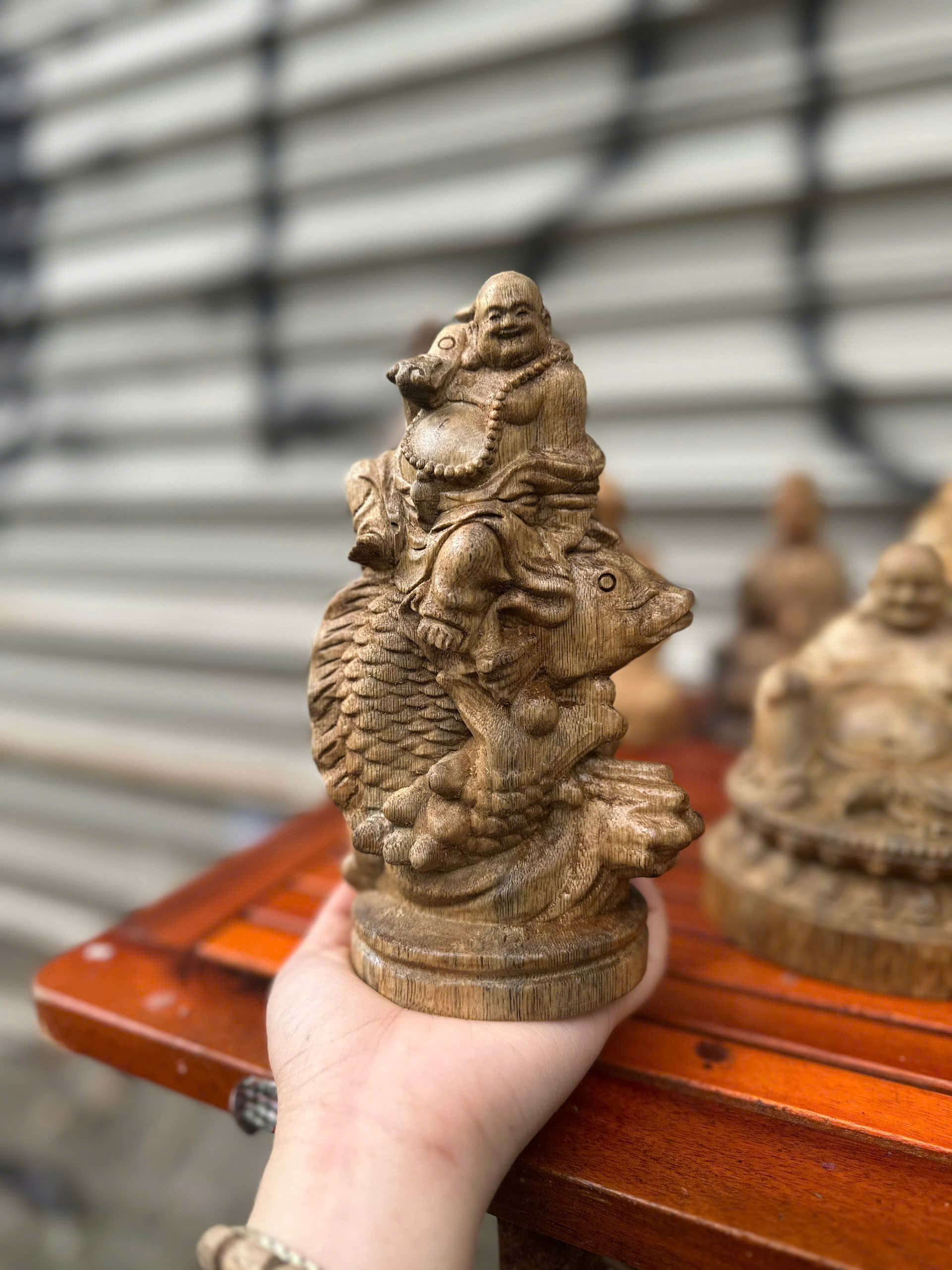 Tượng Phật Di lặc cưỡi cá chép trầm Hương